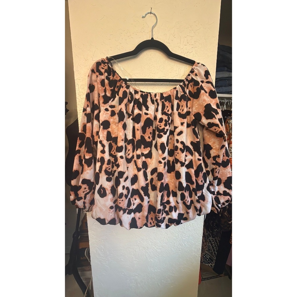 Pink and black off shoulder or on long sleeve blouse